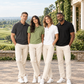 Two women and two men in grey, green, white and black Northmist organic polo t-shirts at a heritage country club